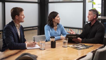 insurance agents talking with sm owner