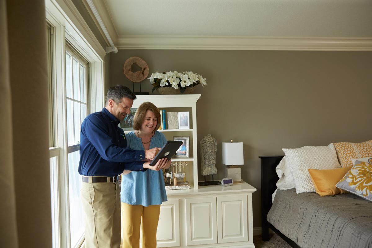 Man and woman looking at tablet together