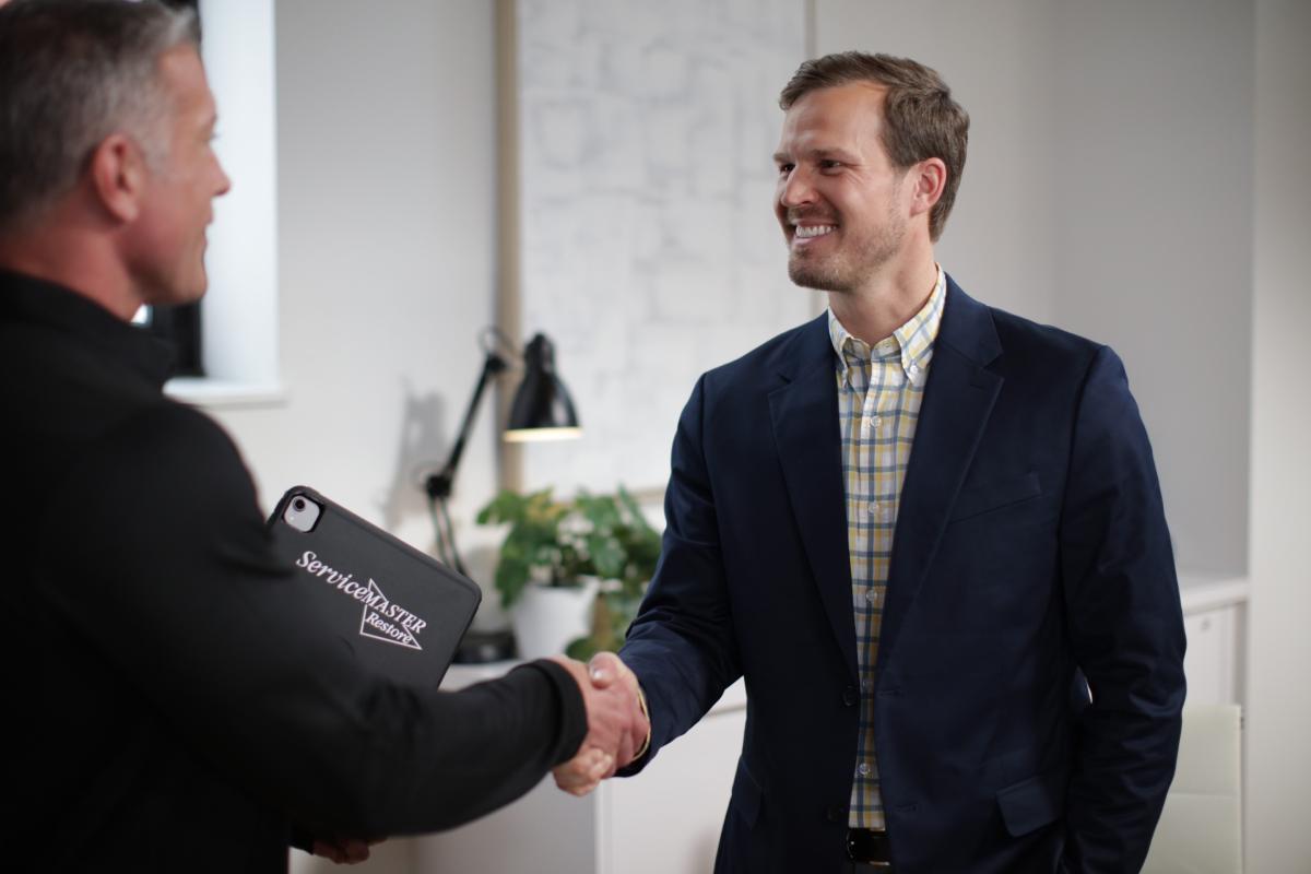 image of a restore leader shaking hands