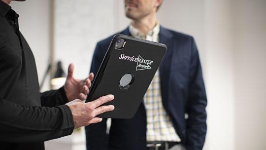 owner looking at servicemaster restore branded ipad