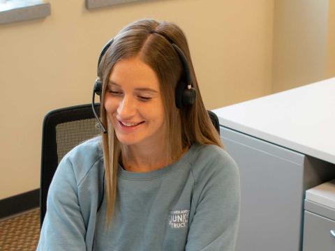 Junk removal customer service rep on phone
