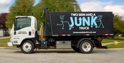 TWO MEN AND A JUNK TRUCK in motion