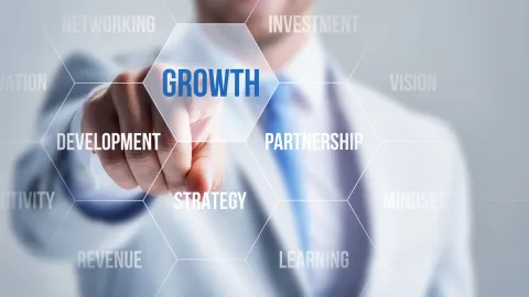 Man pointing to growth text on screen