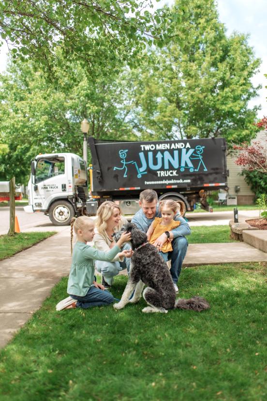 Family in front of Junk truck