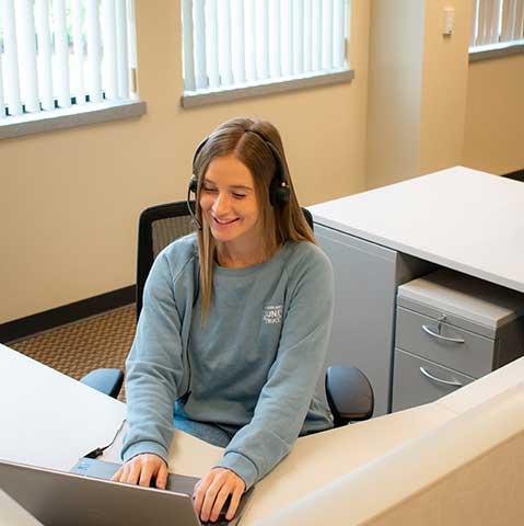 Woman on phone at desk